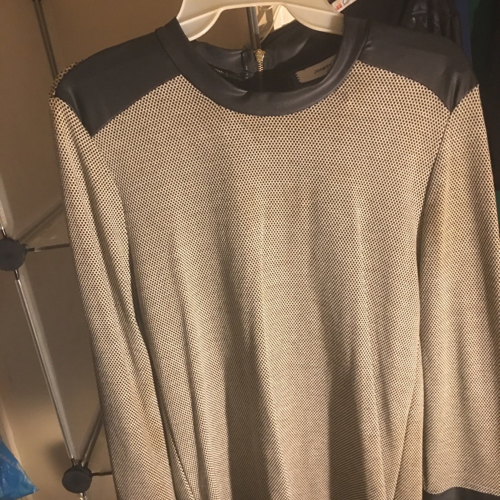 Black and white top with leather neck and cuffs zipper on back